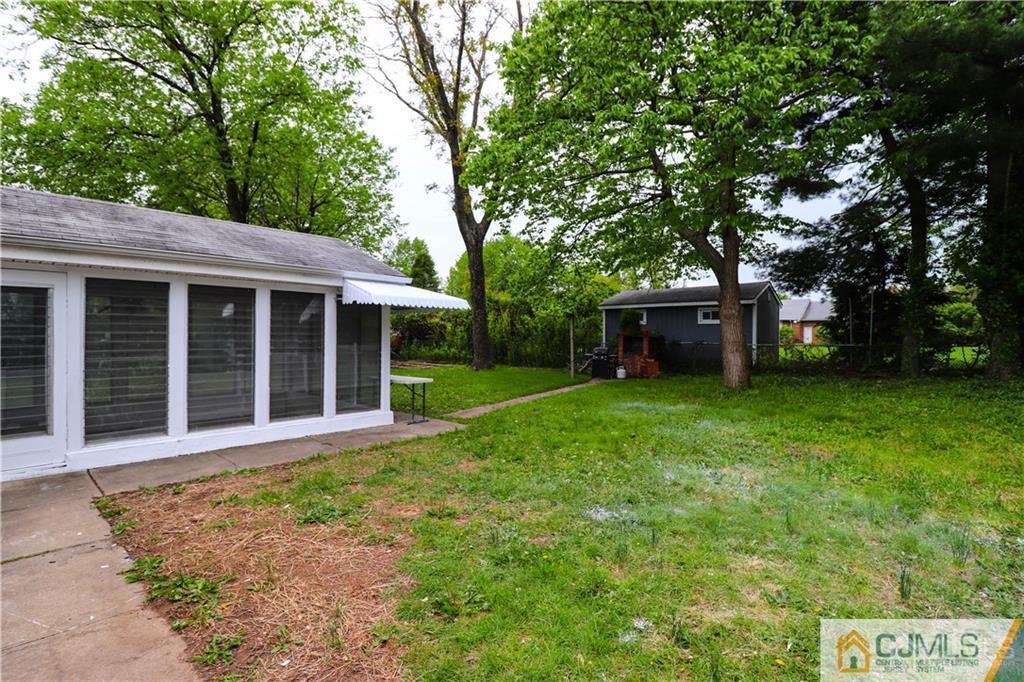 20 Old Post Road Edison, NJ 08817 - Photo 24 of 25 a front view of a house with a garden and yard
