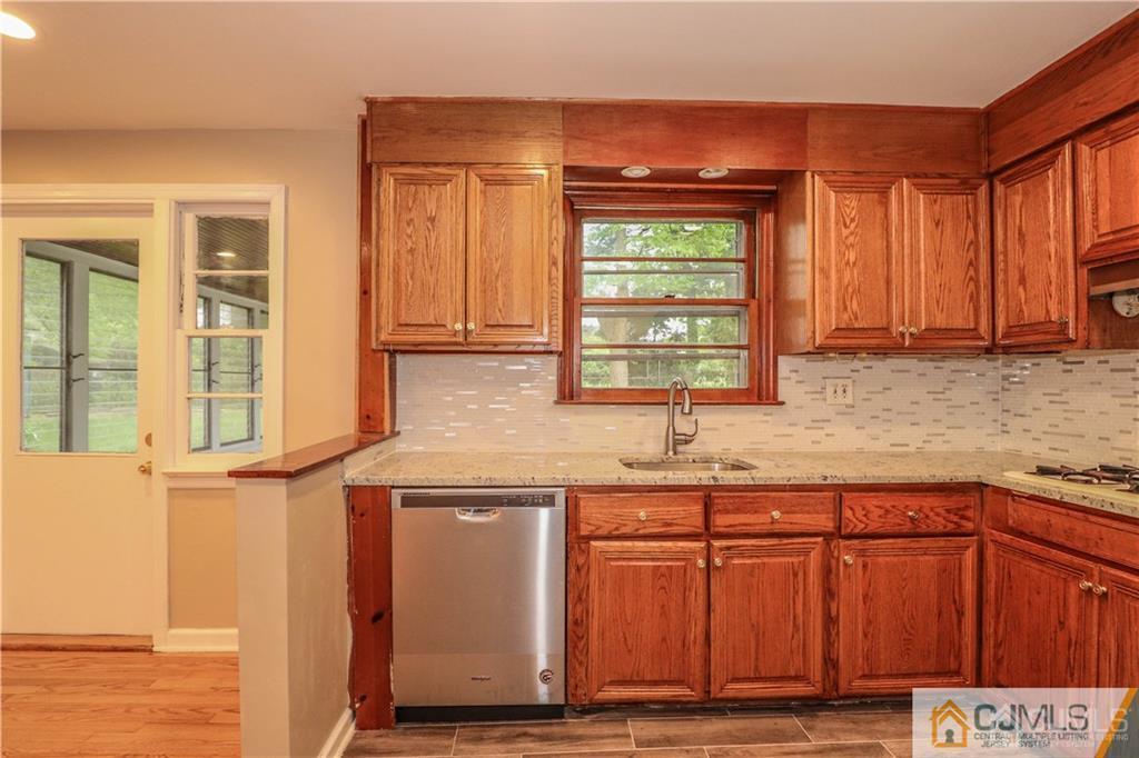20 Old Post Road Edison, NJ 08817 - Photo 6 of 25 a kitchen with stainless steel appliances granite countertop a sink and a cabinets