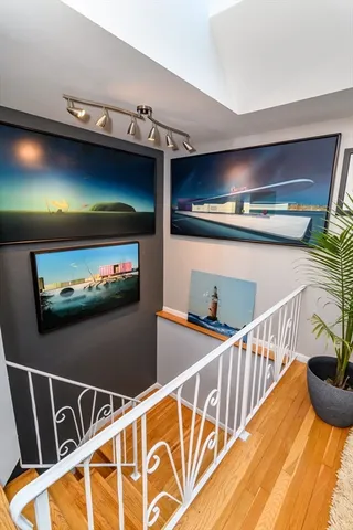 a view of a pool with dining room and furniture