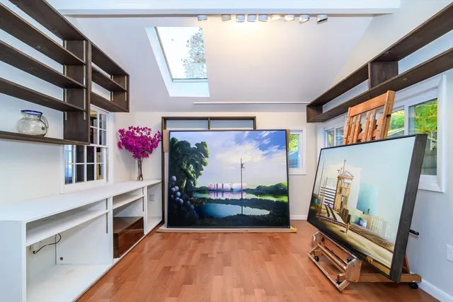 a view of living room with furniture and a fireplace