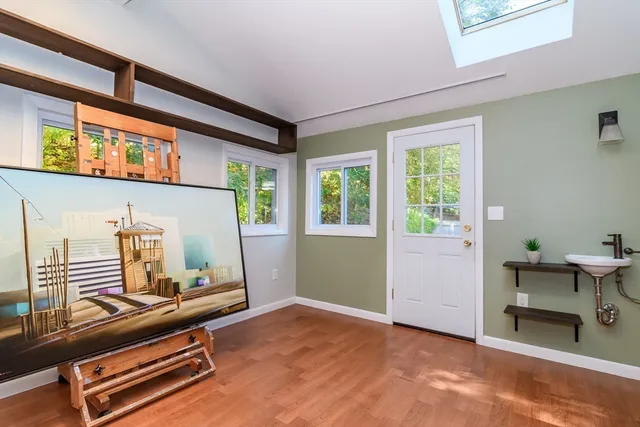 a view of a house with backyard and sitting area