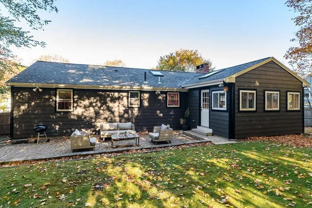 a view of a patio with couches chairs and a fire pit