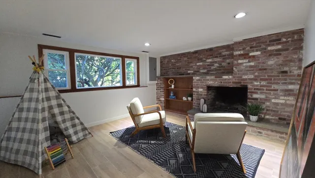 a room with a chair and white walls