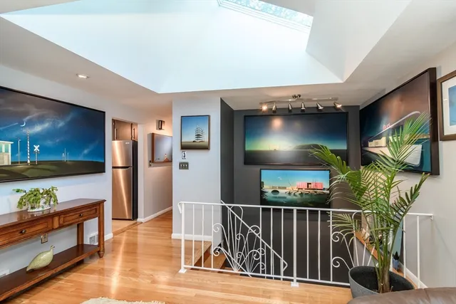 a view of a livingroom with furniture and a flat screen tv