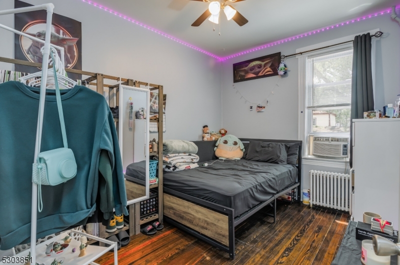 22 Sears Place Clifton, NJ 07011 - Photo 6 of 8 a bedroom with a bed and a window