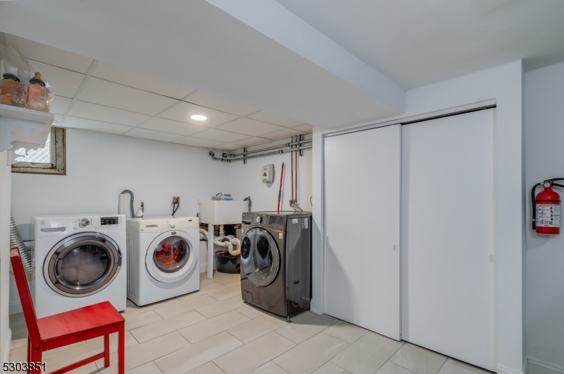 22 Sears Place Clifton, NJ 07011 - Photo 8 of 8 a utility room with dryer and washer