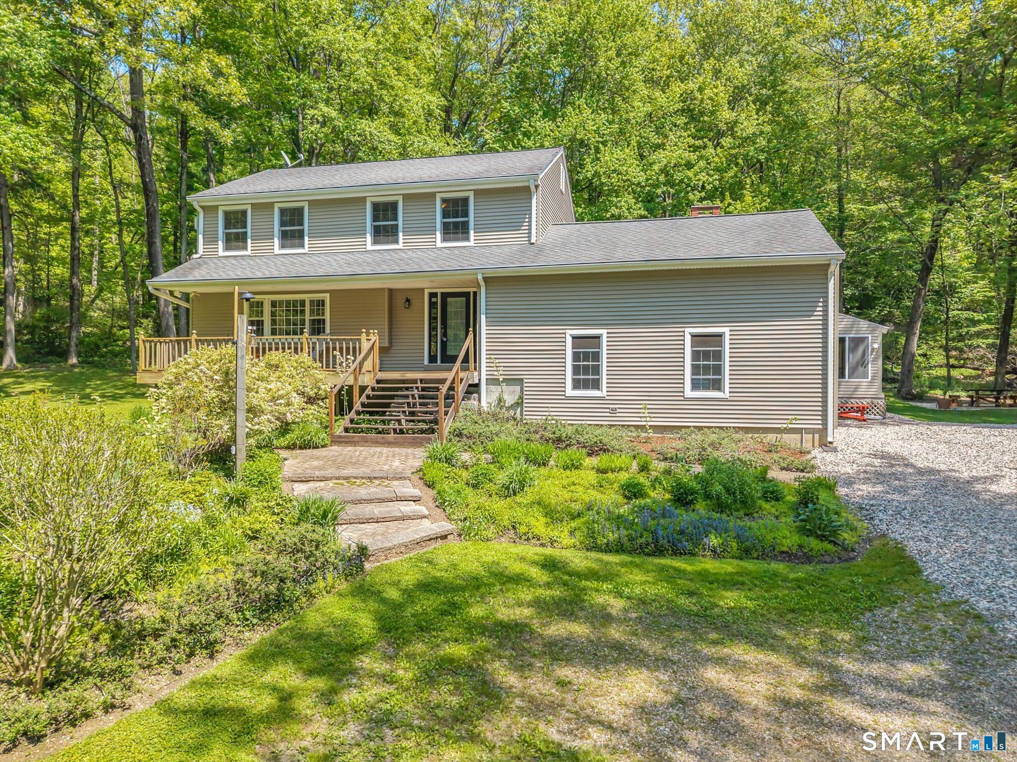 59 Indian Hill Road Canton, CT 06019 - Photo 1 of 39 a front view of a house with garden