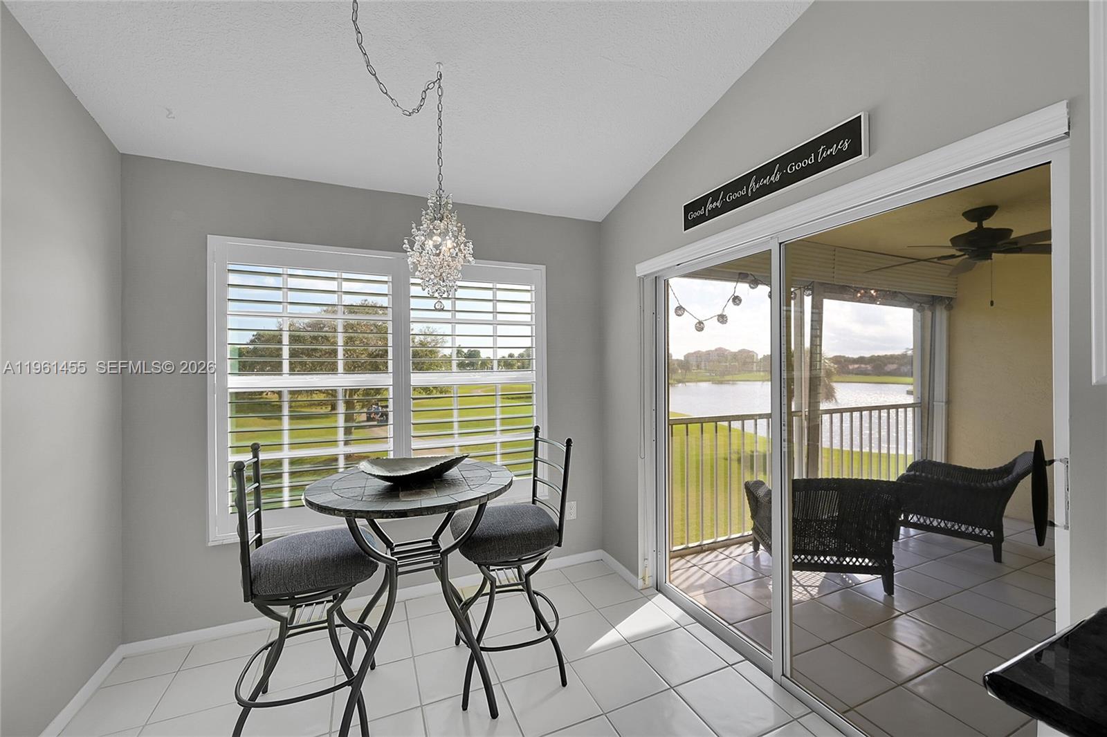 17317 Boca Club Boulevard, Unit 7 Boca Raton, FL 33487 - Photo 24 of 48 a dining room with furniture and large windows