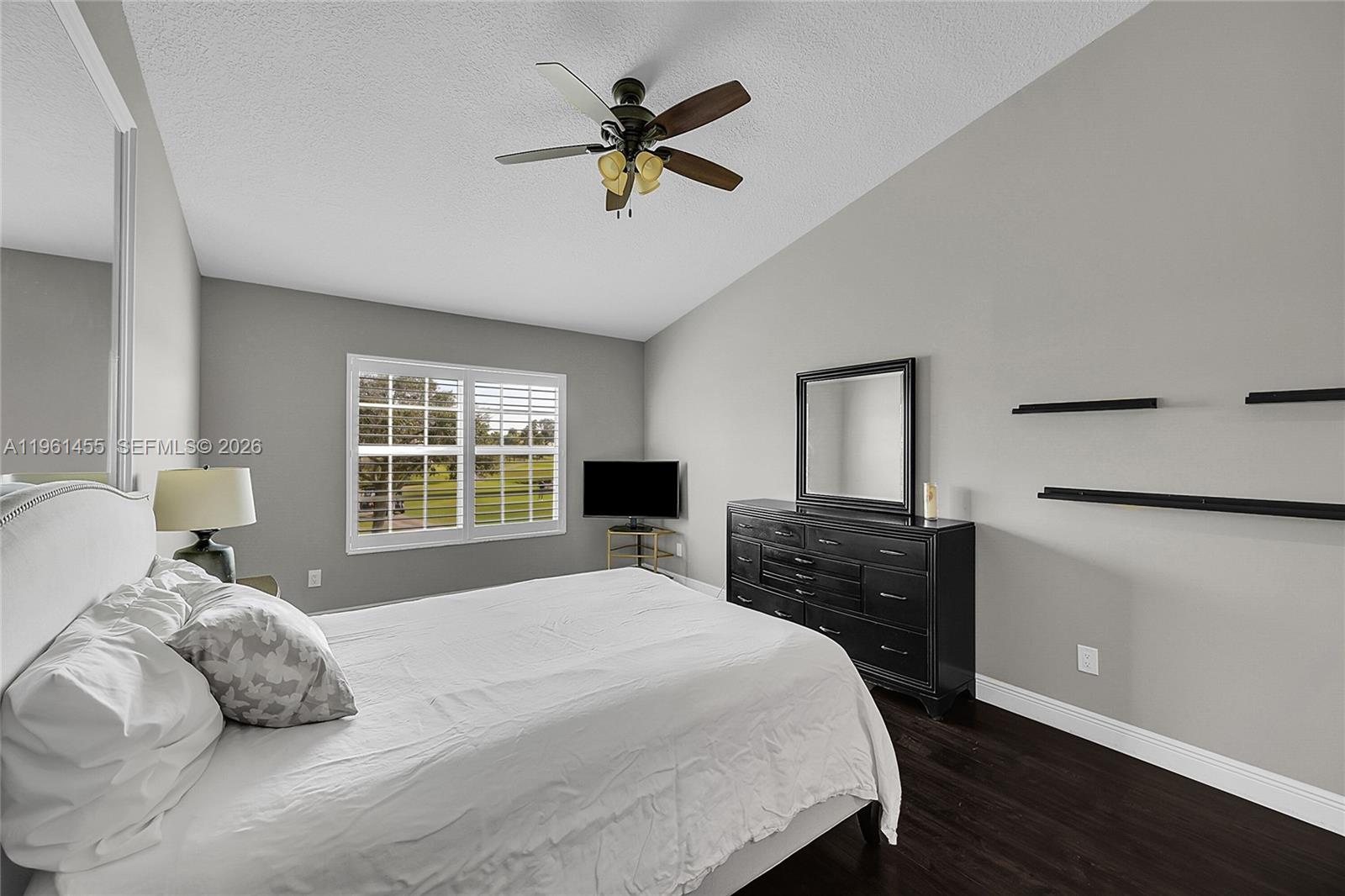 17317 Boca Club Boulevard, Unit 7 Boca Raton, FL 33487 - Photo 28 of 48 a bedroom with a bed and window