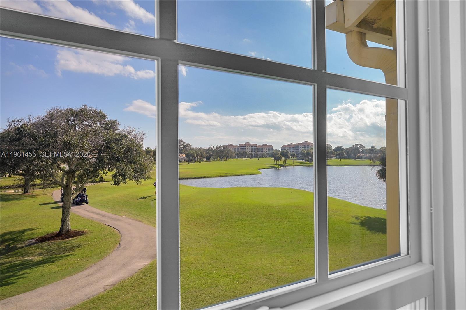 17317 Boca Club Boulevard, Unit 7 Boca Raton, FL 33487 - Photo 31 of 48 a view of a porch with couches and wooden floor