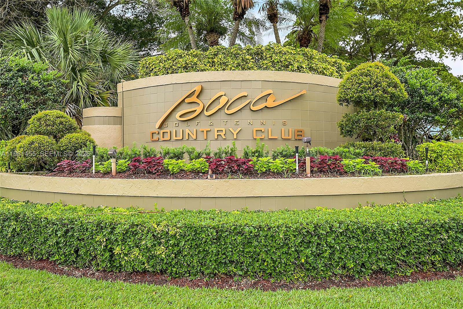 17317 Boca Club Boulevard, Unit 7 Boca Raton, FL 33487 - Photo 7 of 48 a sign on the side of a building
