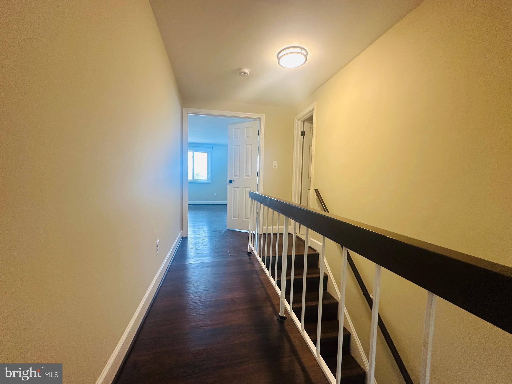 102 Hayloft Circle Sterling, VA 20164 - Photo 19 of 39 a view of a hallway with wooden floor