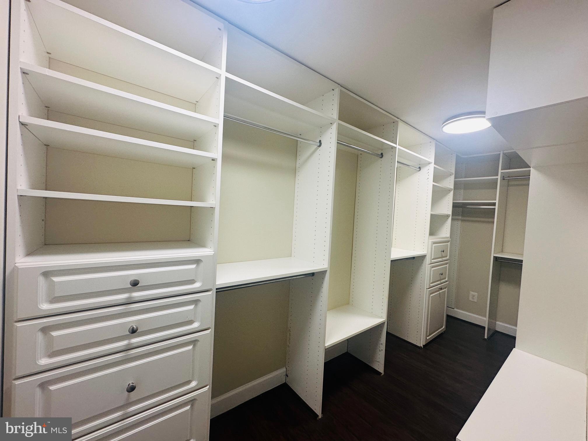 102 Hayloft Circle Sterling, VA 20164 - Photo 22 of 39 a walk in closet with wooden floor