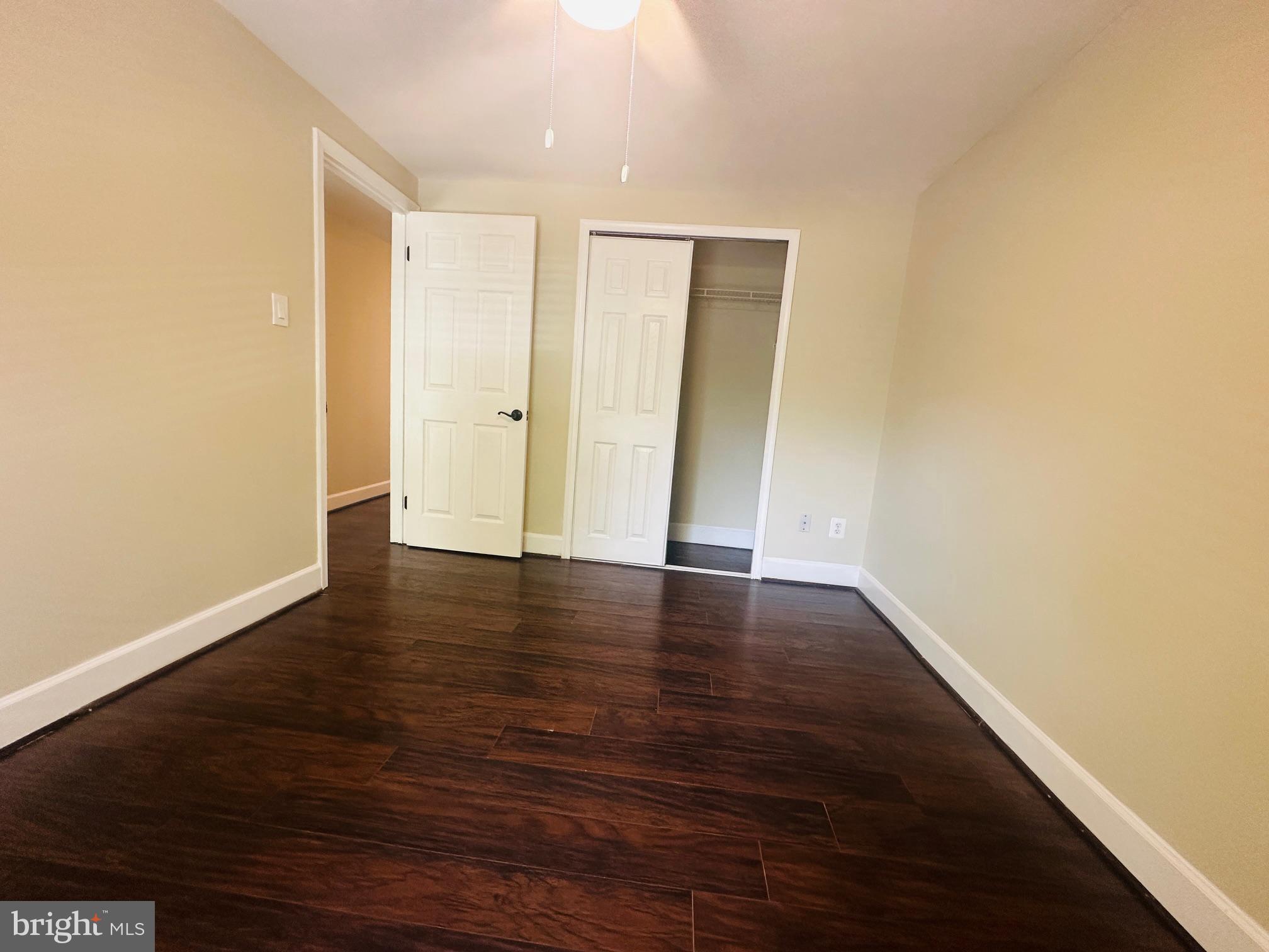 102 Hayloft Circle Sterling, VA 20164 - Photo 29 of 39 a view of a room with wooden floor and white walls