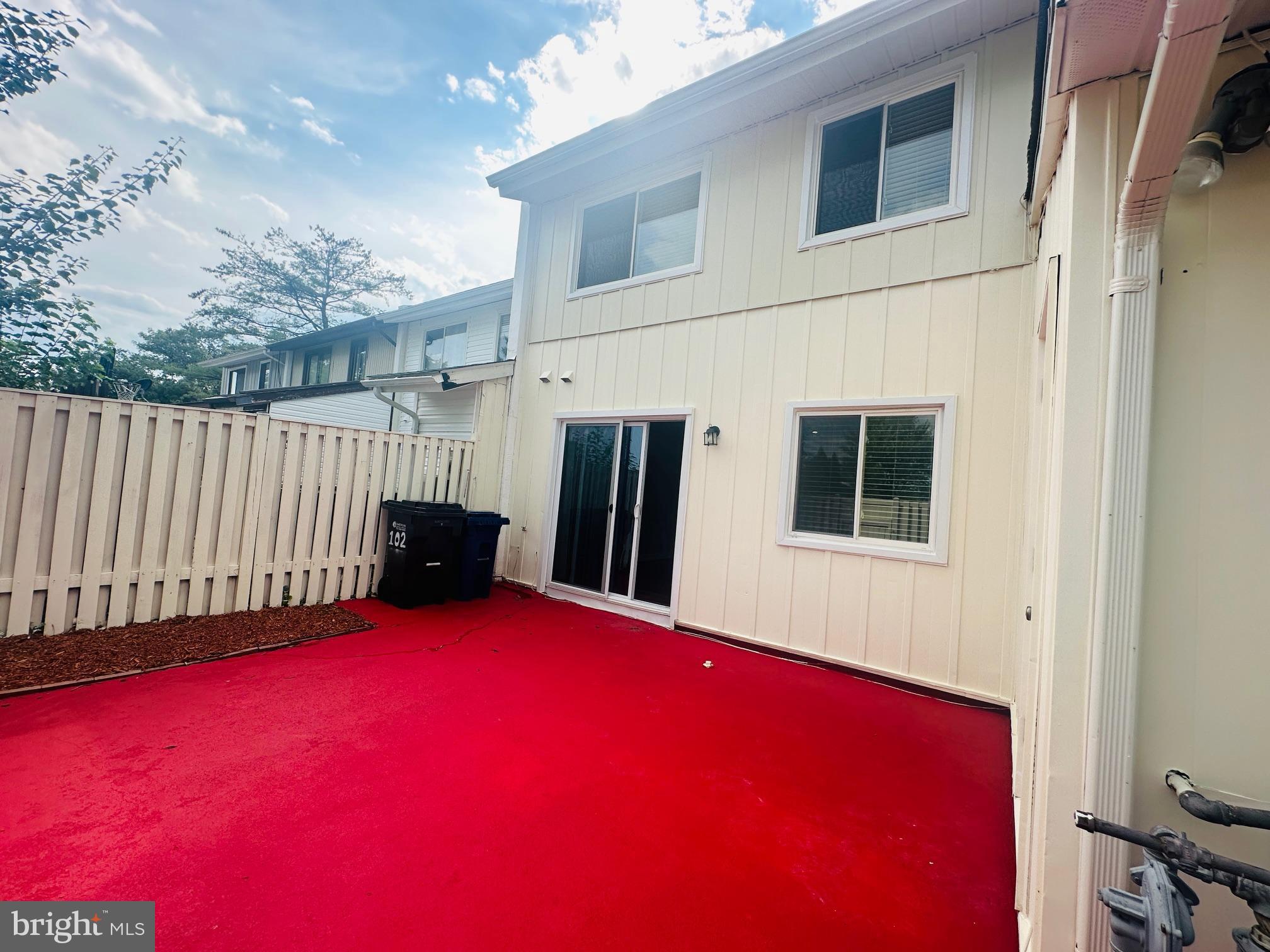 102 Hayloft Circle Sterling, VA 20164 - Photo 38 of 39 a view of a house with backyard and porch