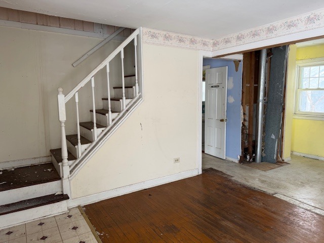 2500 Maple Street Des Plaines, IL 60018 - Photo 3 of 9 a view of an entryway with wooden floor and stairs