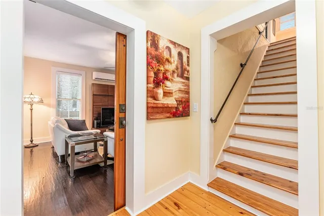 an aerial view of residential houses with outdoor space and swimming pool
