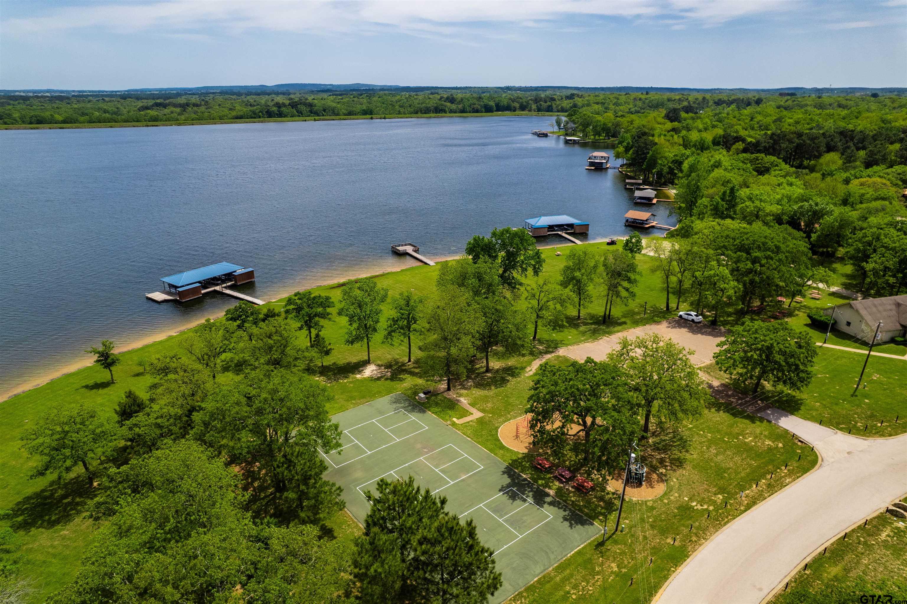 3597 Pedernales North Athens, TX 75752 - Photo 30 of 32 a aerial view of a house with a yard and lake view