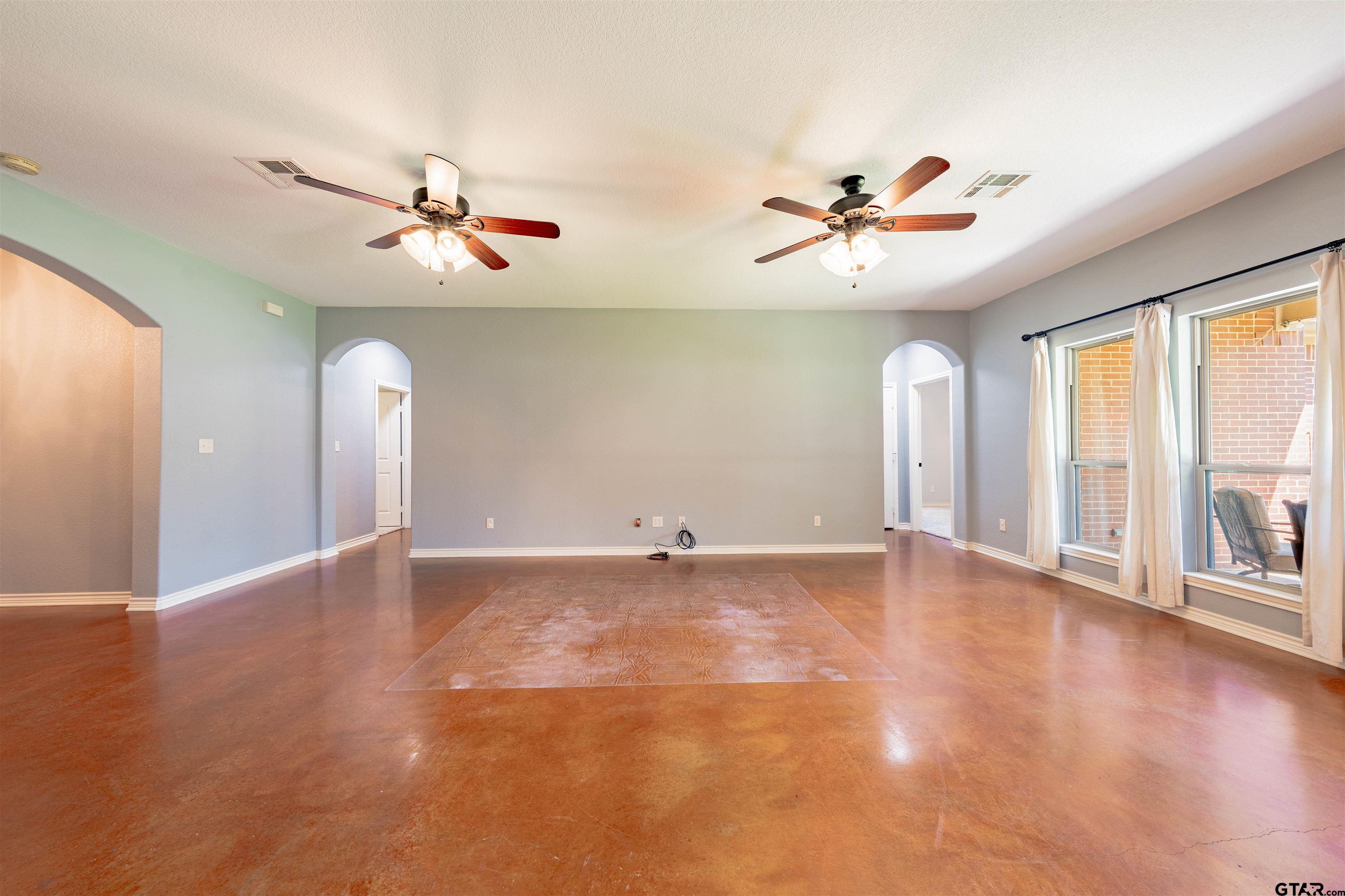 3597 Pedernales North Athens, TX 75752 - Photo 4 of 32 wooden floor in an empty room with a window