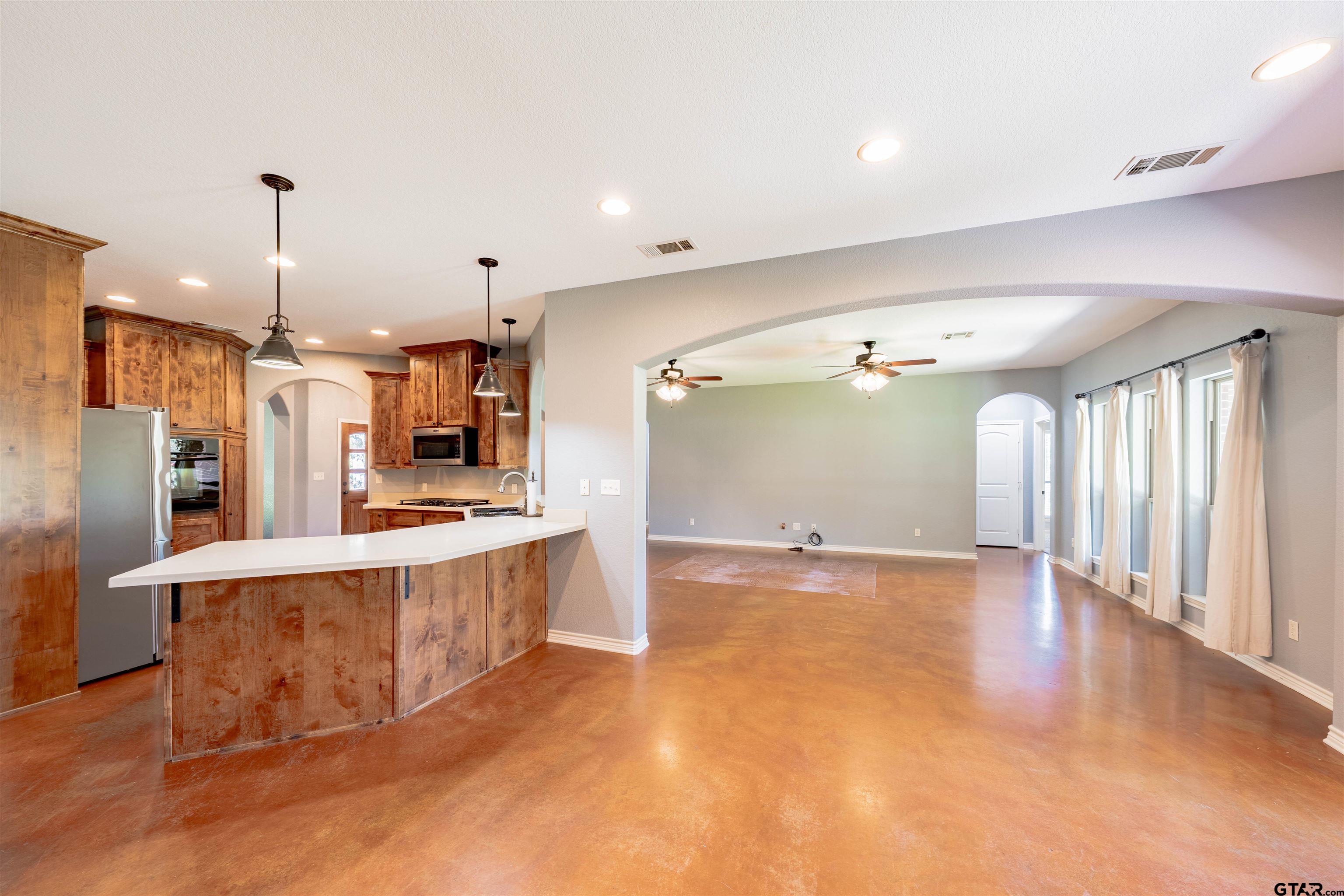 3597 Pedernales North Athens, TX 75752 - Photo 9 of 32 a large kitchen with a lot of counter space and a wooden floor