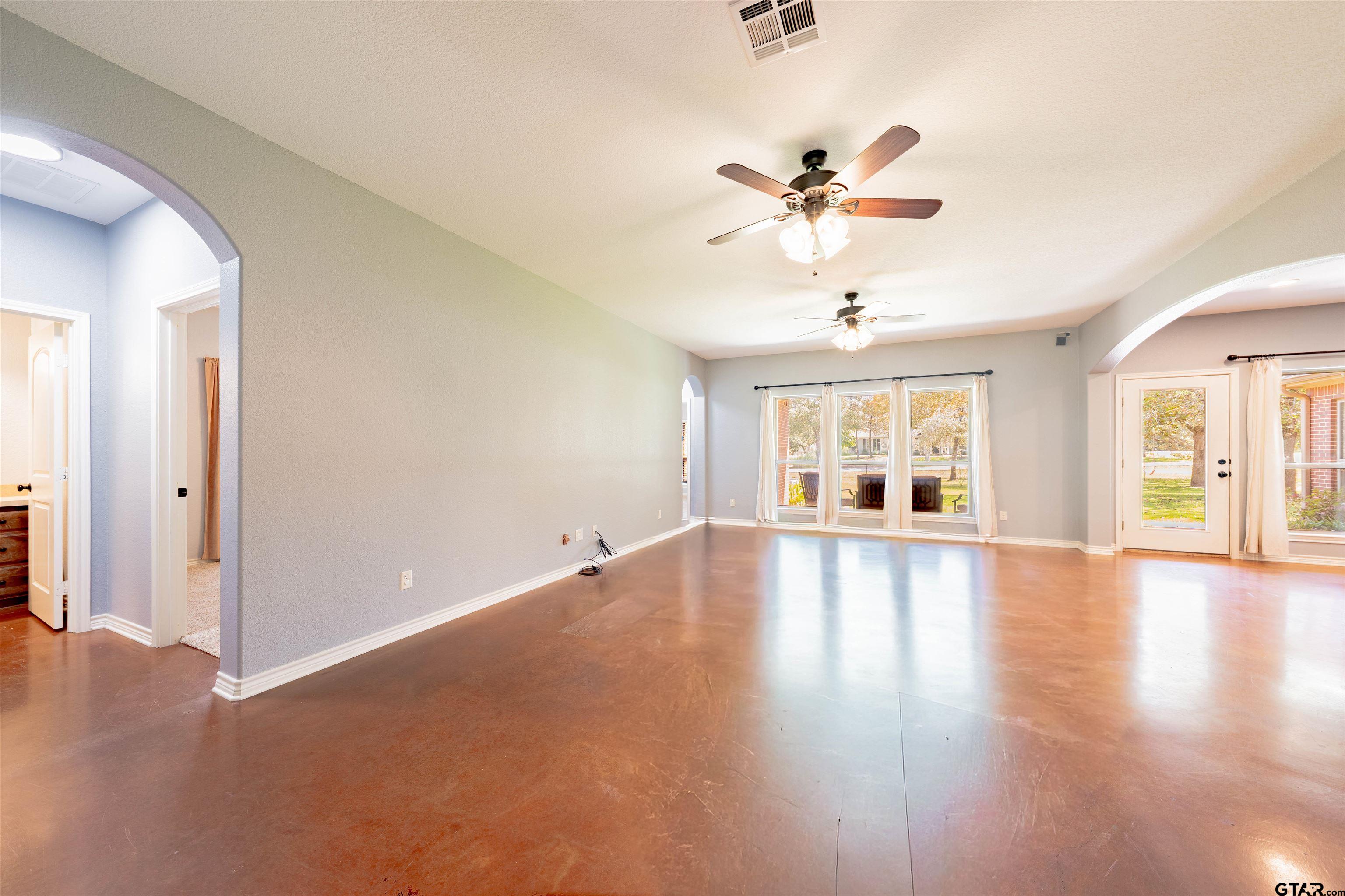 3597 Pedernales North Athens, TX 75752 - Photo 10 of 32 a view of an empty room with window and wooden floor