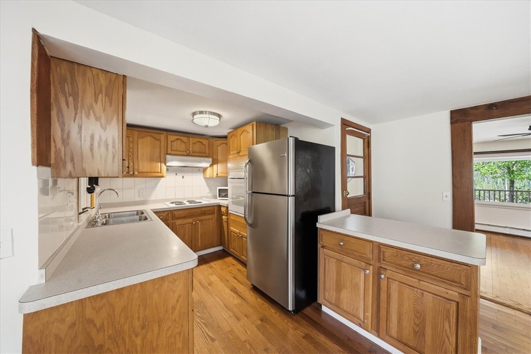 322 Rocky Hill Road Scituate, RI 02857 - Photo 20 of 50 Bright and functional kitchen with ample cabinetry, generous counter space, and a convenient peninsula for additional prep .