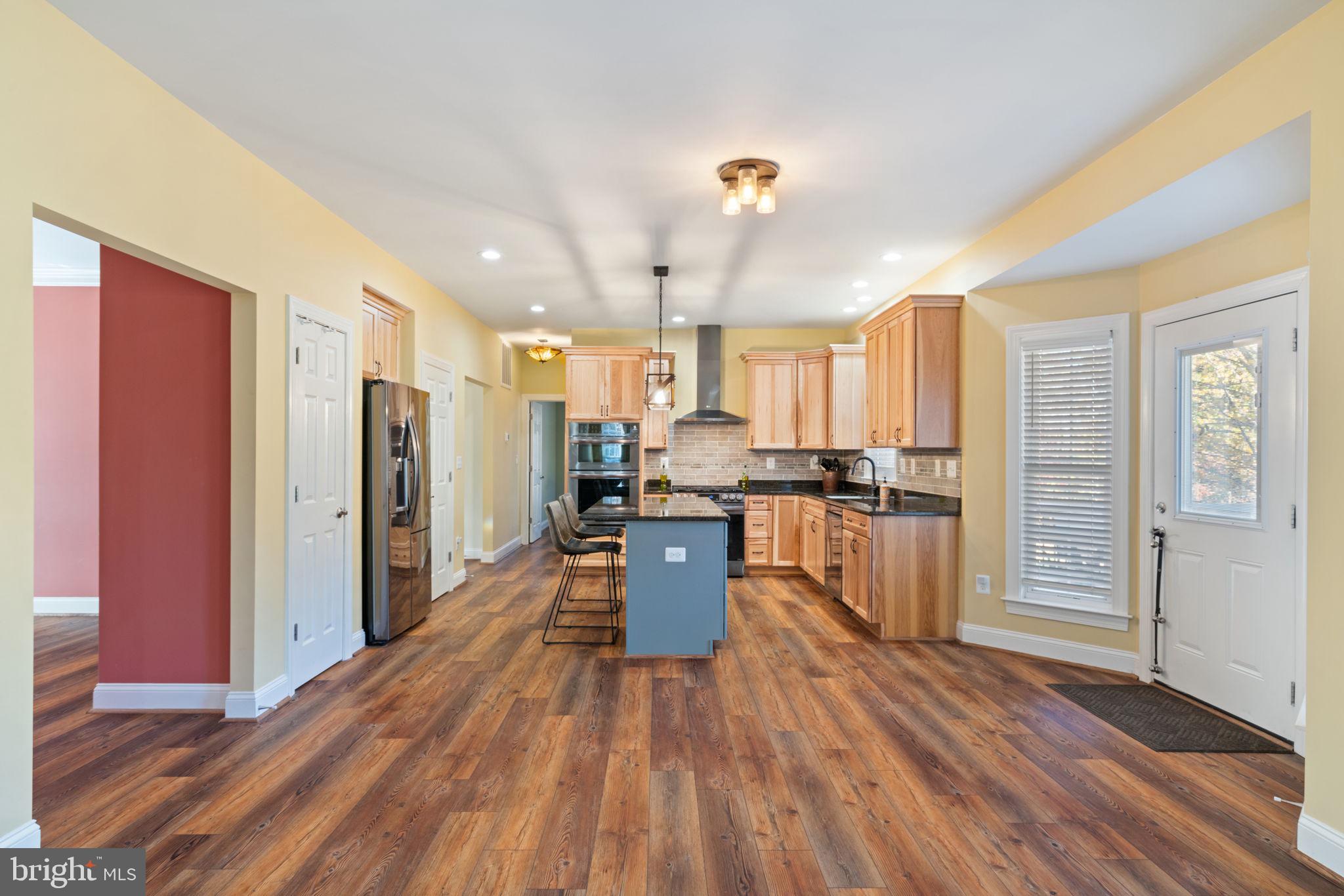 2182 Towles Road Midland, VA 22728 - Photo 20 of 50 a kitchen with stainless steel appliances a refrigerator and wooden floor