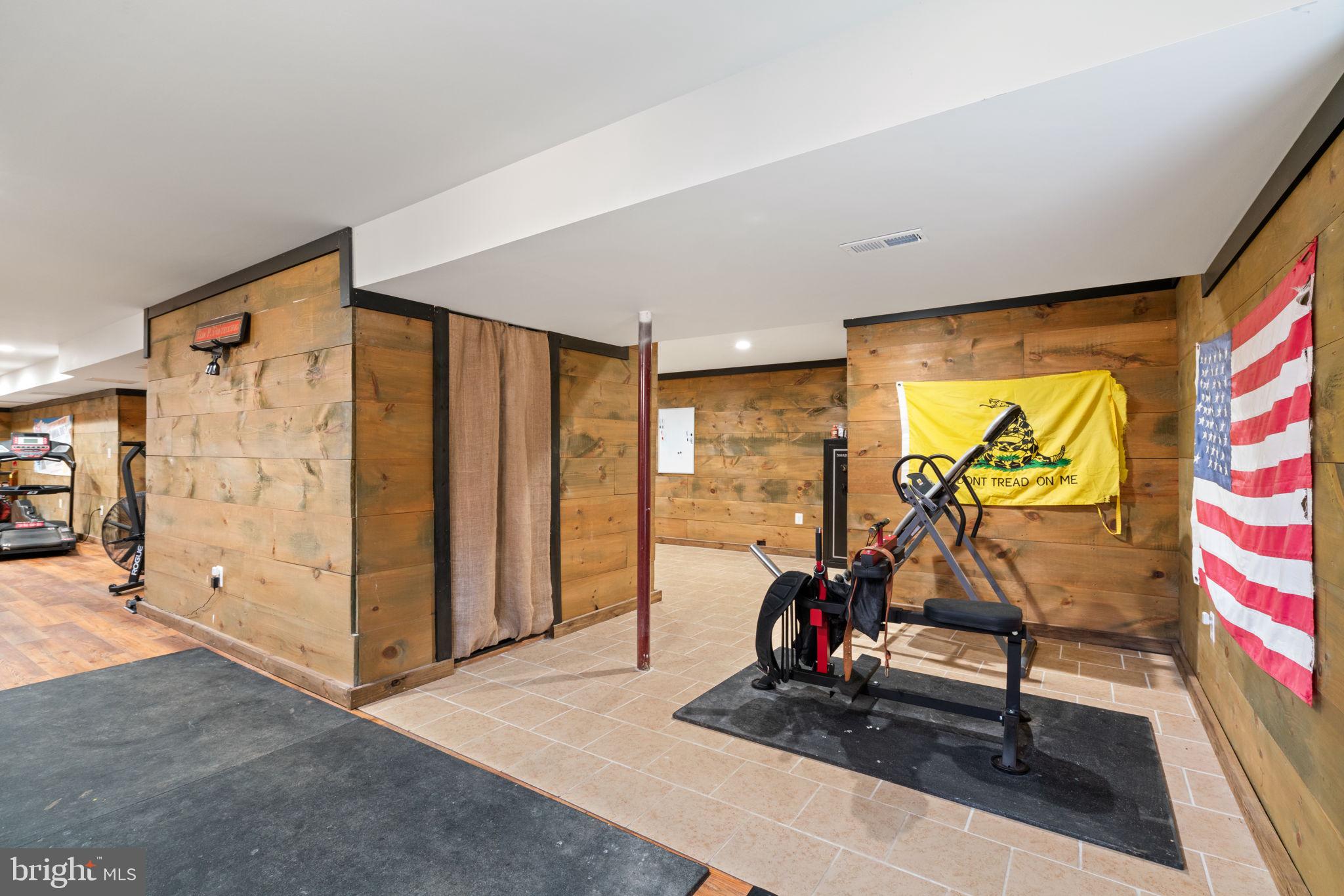 2182 Towles Road Midland, VA 22728 - Photo 36 of 50 a living room with furniture and a flat screen tv