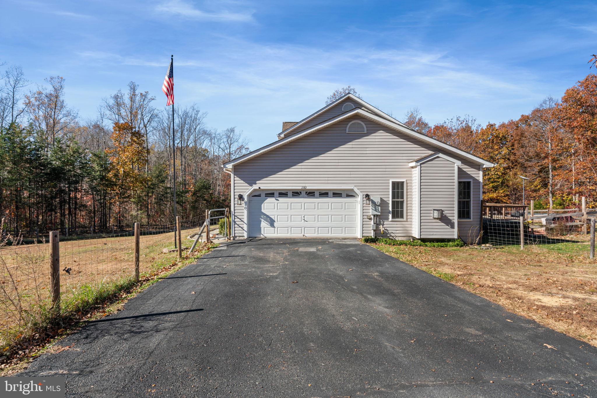2182 Towles Road Midland, VA 22728 - Photo 50 of 50 a view of a house with a yard and large tree