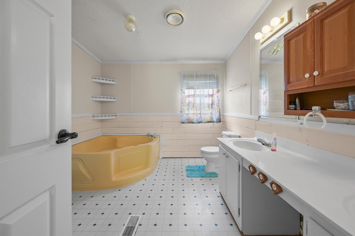 6439 Cedar Grove Road Big Sandy, TN 38221 - Photo 13 of 38 a bathroom with a sink a tub a mirror and a shower