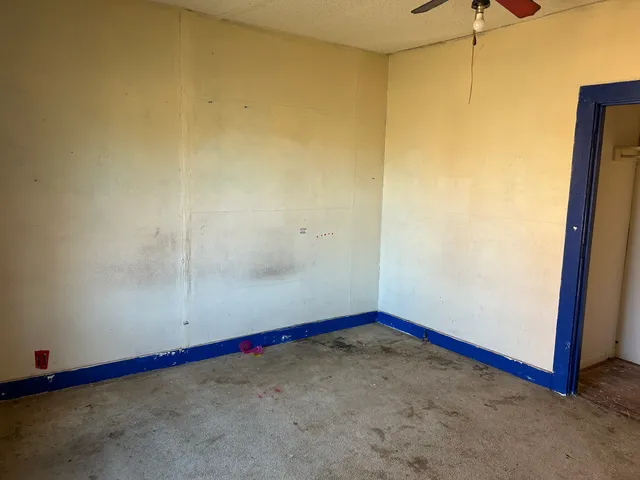 a view of an empty room and window