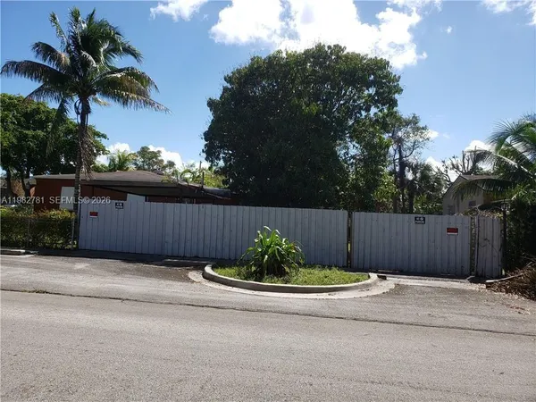 a view of a backyard of the house