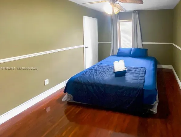 a living room with a bed