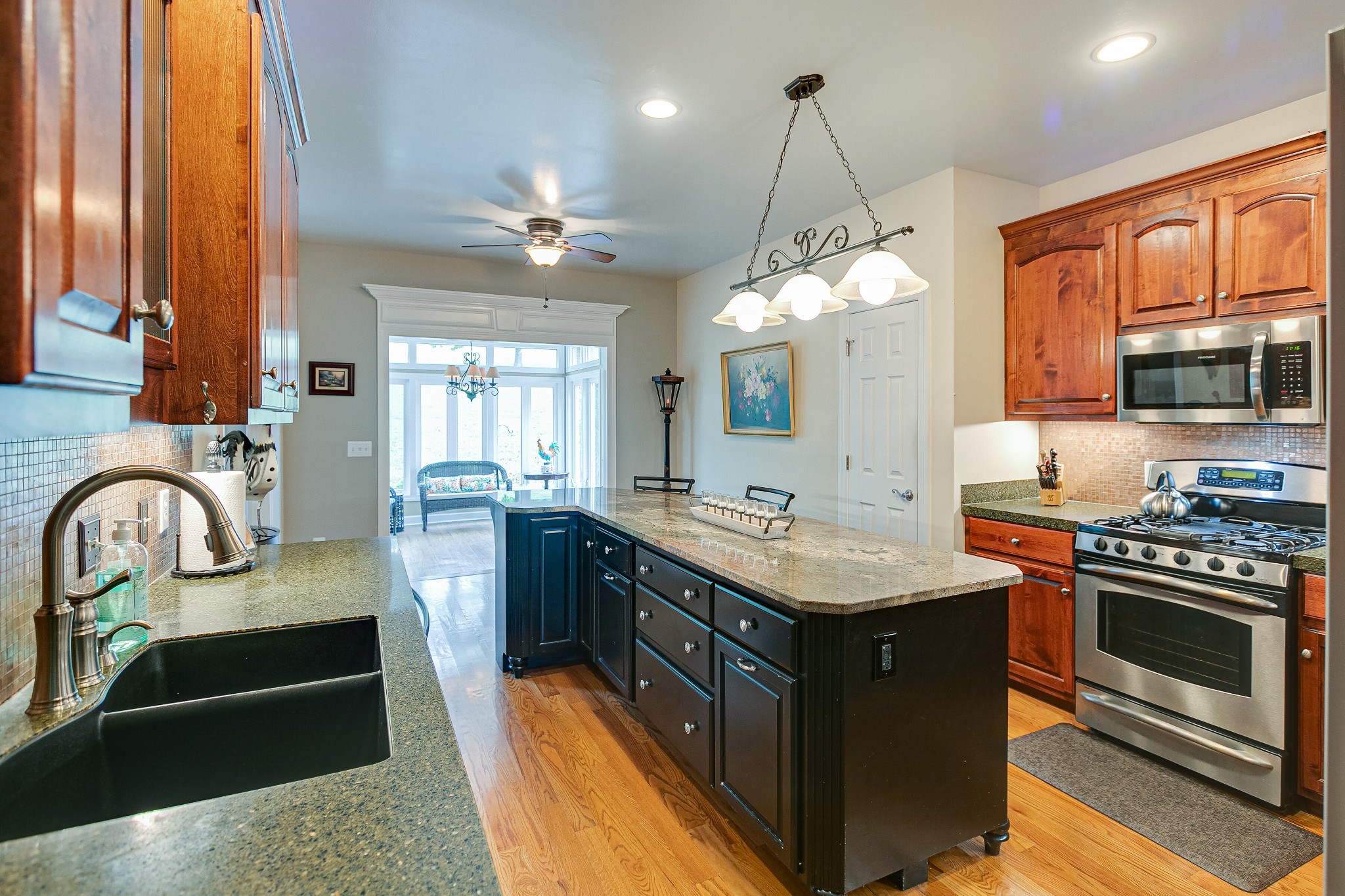 3013 Viewpointe Way Columbia, TN 38401 - Photo 19 of 39 a kitchen with kitchen island granite countertop a stove and a sink