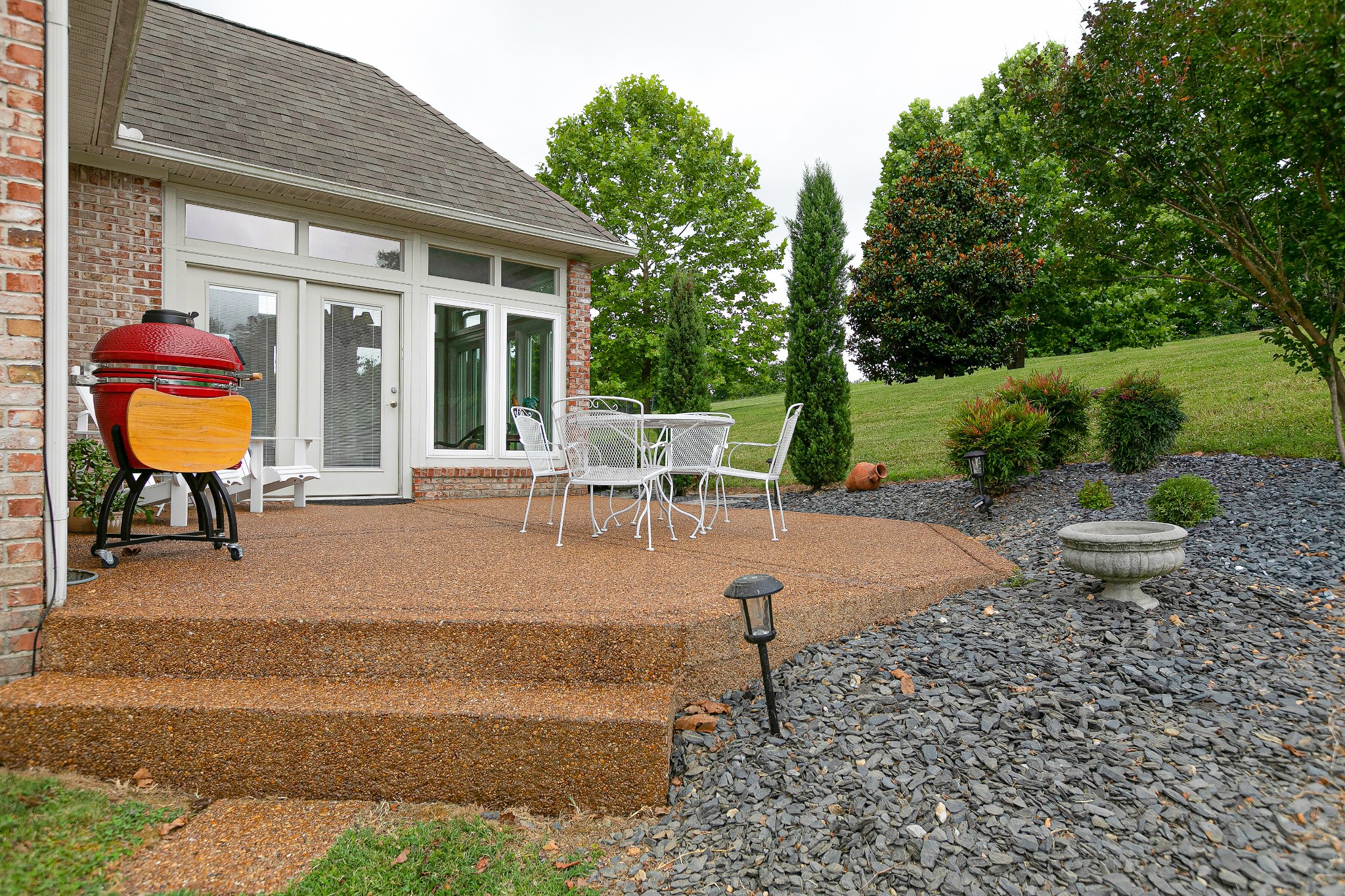 3013 Viewpointe Way Columbia, TN 38401 - Photo 34 of 39 a view of a patio with table and chairs next to a yard