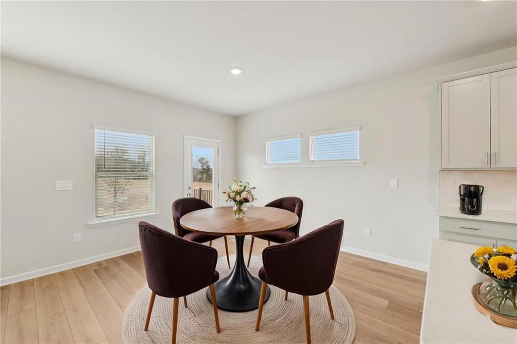 405 Morgan Crk Road Pendergrass, GA 30567 - Photo 11 of 48 a view of a dining room with furniture and wooden floor
