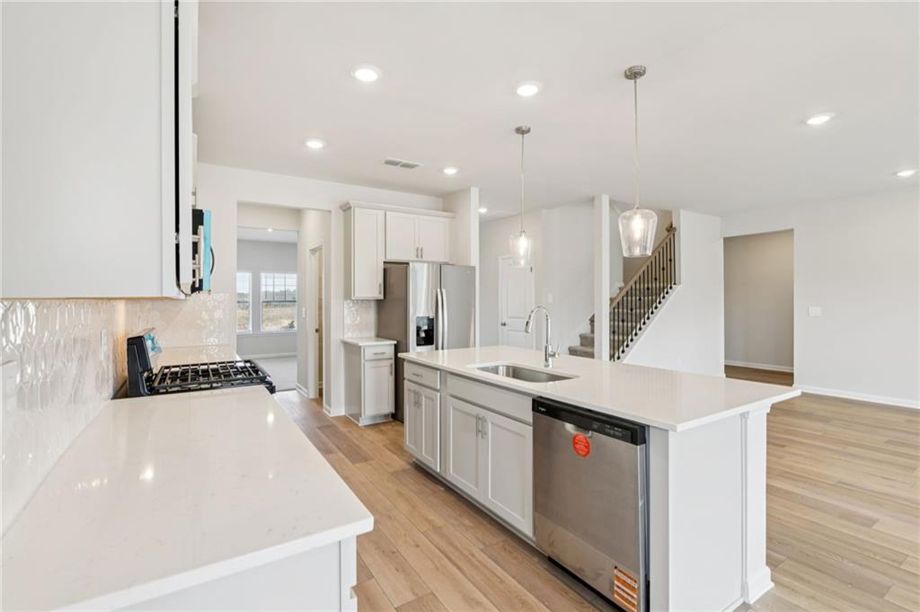 405 Morgan Crk Road Pendergrass, GA 30567 - Photo 19 of 48 a kitchen with stainless steel appliances a sink stove and refrigerator