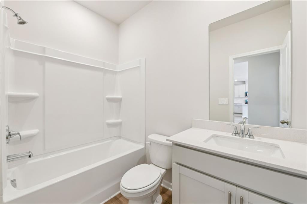 405 Morgan Crk Road Pendergrass, GA 30567 - Photo 23 of 48 a bathroom with a sink a toilet and a bathtub