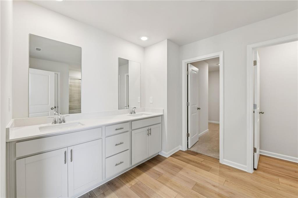405 Morgan Crk Road Pendergrass, GA 30567 - Photo 32 of 48 a spacious bathroom with a double vanity sink mirror and double