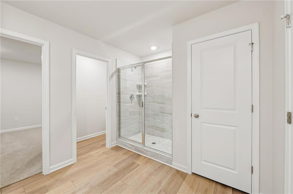 405 Morgan Crk Road Pendergrass, GA 30567 - Photo 33 of 48 a bathroom with a glass shower door