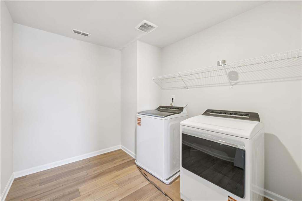 405 Morgan Crk Road Pendergrass, GA 30567 - Photo 35 of 48 a view of storage and utility room with washer and dryer