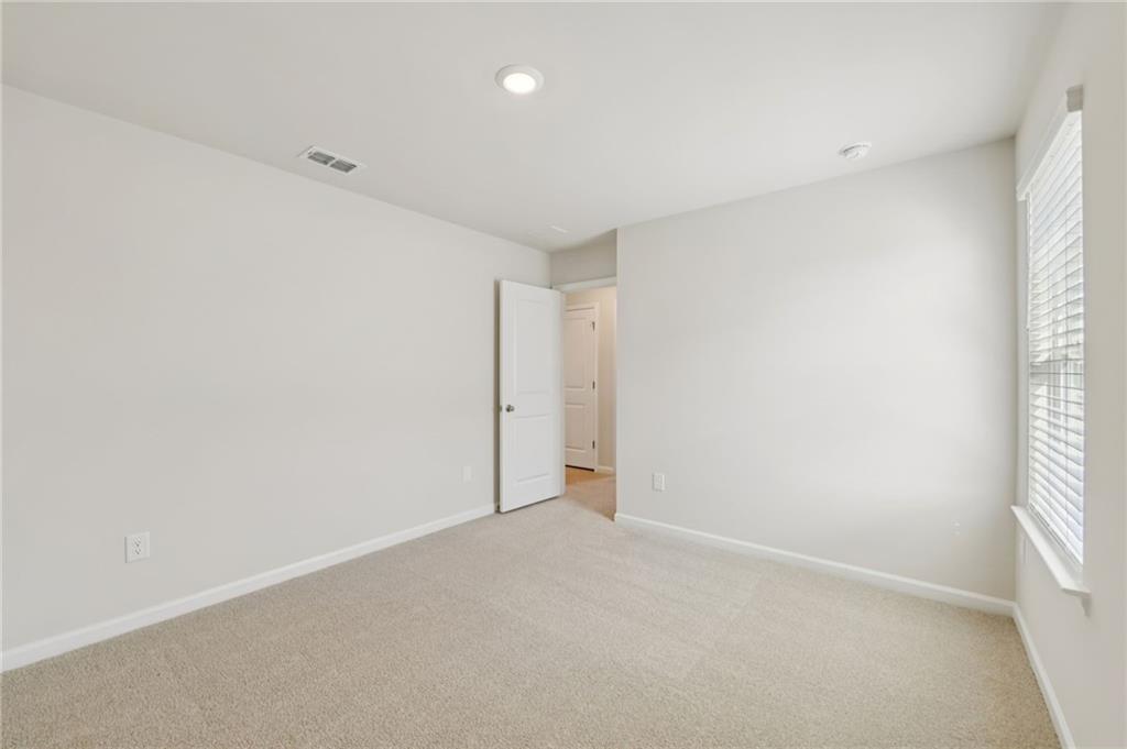 405 Morgan Crk Road Pendergrass, GA 30567 - Photo 42 of 48 an empty room with windows