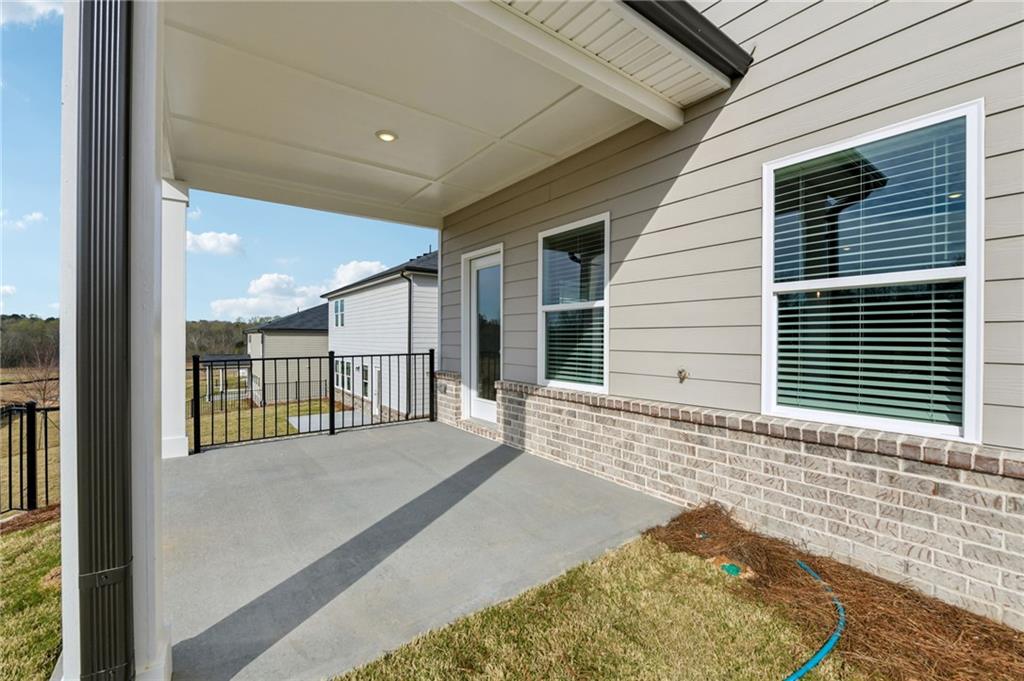 405 Morgan Crk Road Pendergrass, GA 30567 - Photo 44 of 48 a view of a porch with a table and chairs
