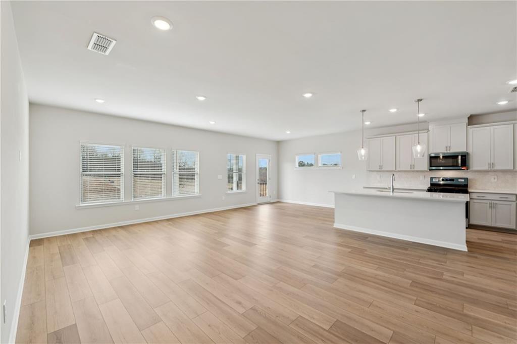 405 Morgan Crk Road Pendergrass, GA 30567 - Photo 6 of 48 a view of kitchen with kitchen island wooden floor and stainless steel appliances