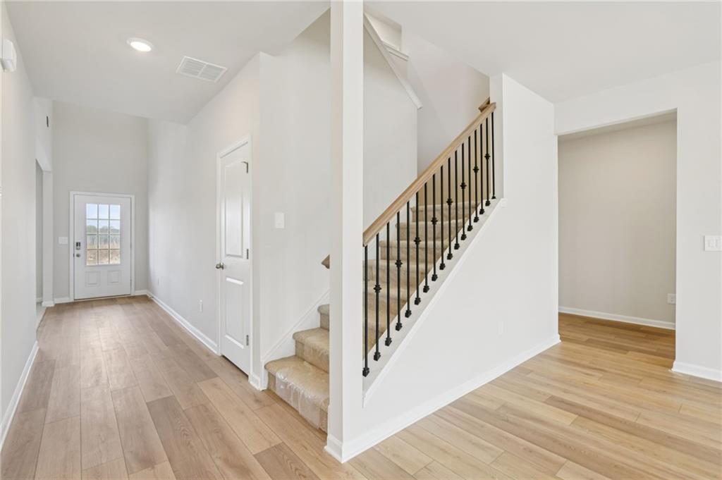 405 Morgan Crk Road Pendergrass, GA 30567 - Photo 9 of 48 a view of a hallway with wooden floor and entryway