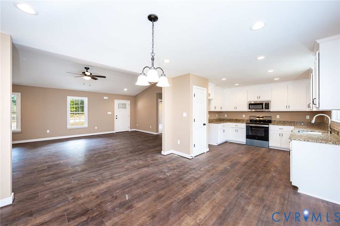 1900 Moody Fox Lane Carson, VA 23830 - Photo 11 of 38 a view of a kitchen with granite countertop stainless steel appliances and wooden floor
