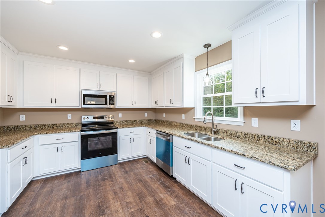 1900 Moody Fox Lane Carson, VA 23830 - Photo 12 of 38 a kitchen with granite countertop cabinets stainless steel appliances a sink and a window