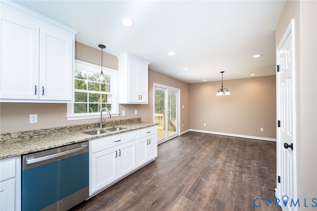 1900 Moody Fox Lane Carson, VA 23830 - Photo 14 of 38 a kitchen with granite countertop a sink and a stove top oven
