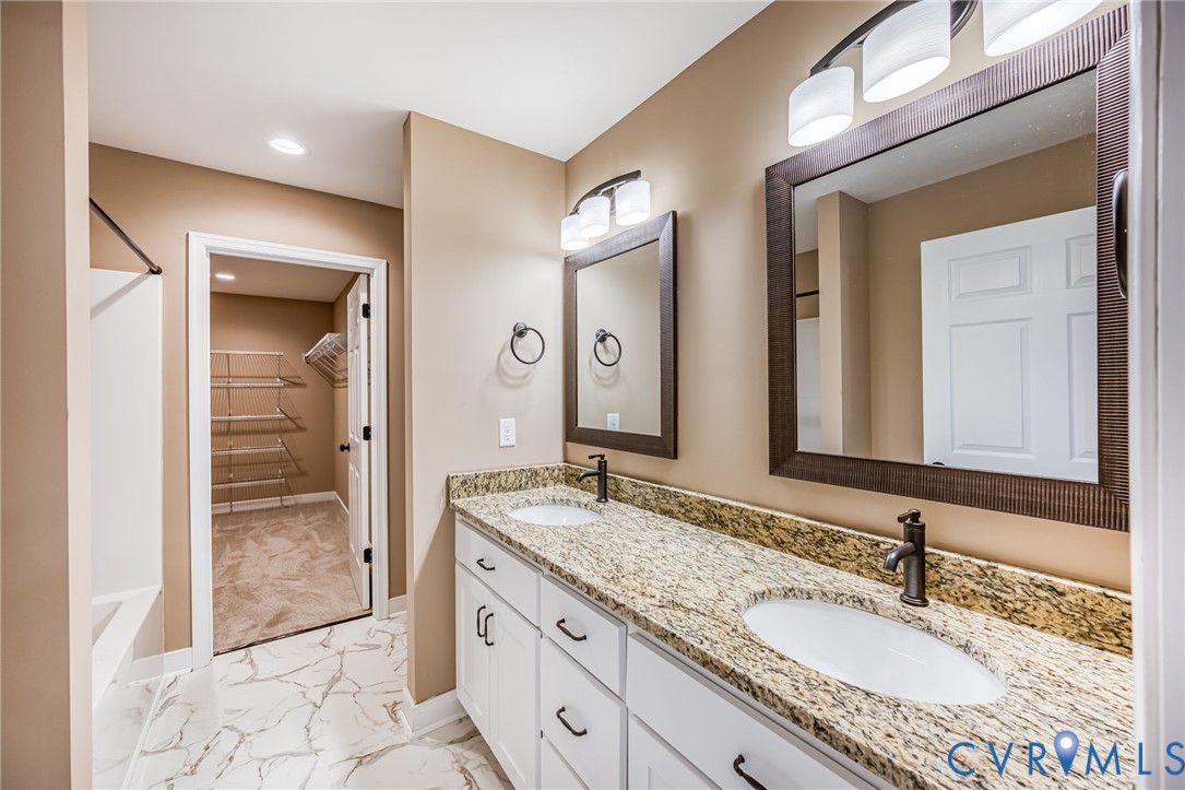 1900 Moody Fox Lane Carson, VA 23830 - Photo 17 of 38 a bathroom with a granite countertop sink and a mirror