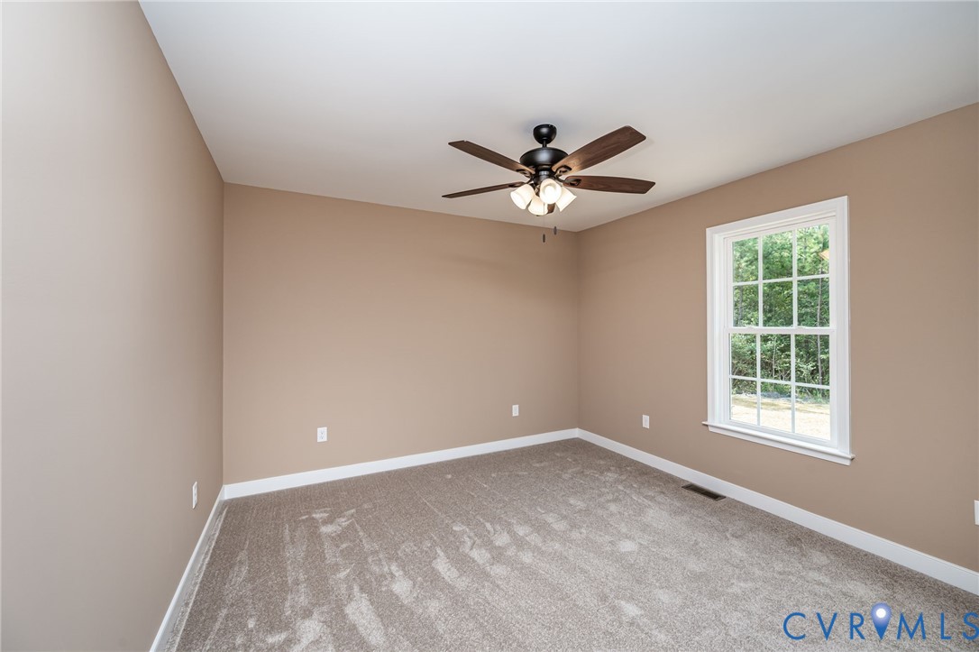 1900 Moody Fox Lane Carson, VA 23830 - Photo 20 of 38 an empty room with a window